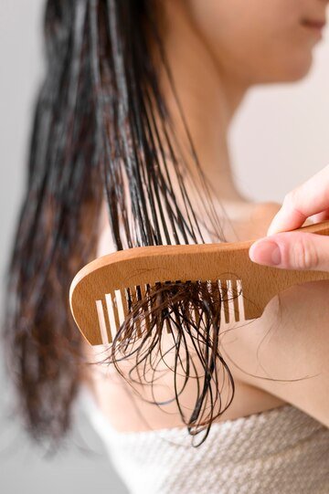 Specialist administering GFC hair growth treatment at Hues Aesthetic Clinic Madurai