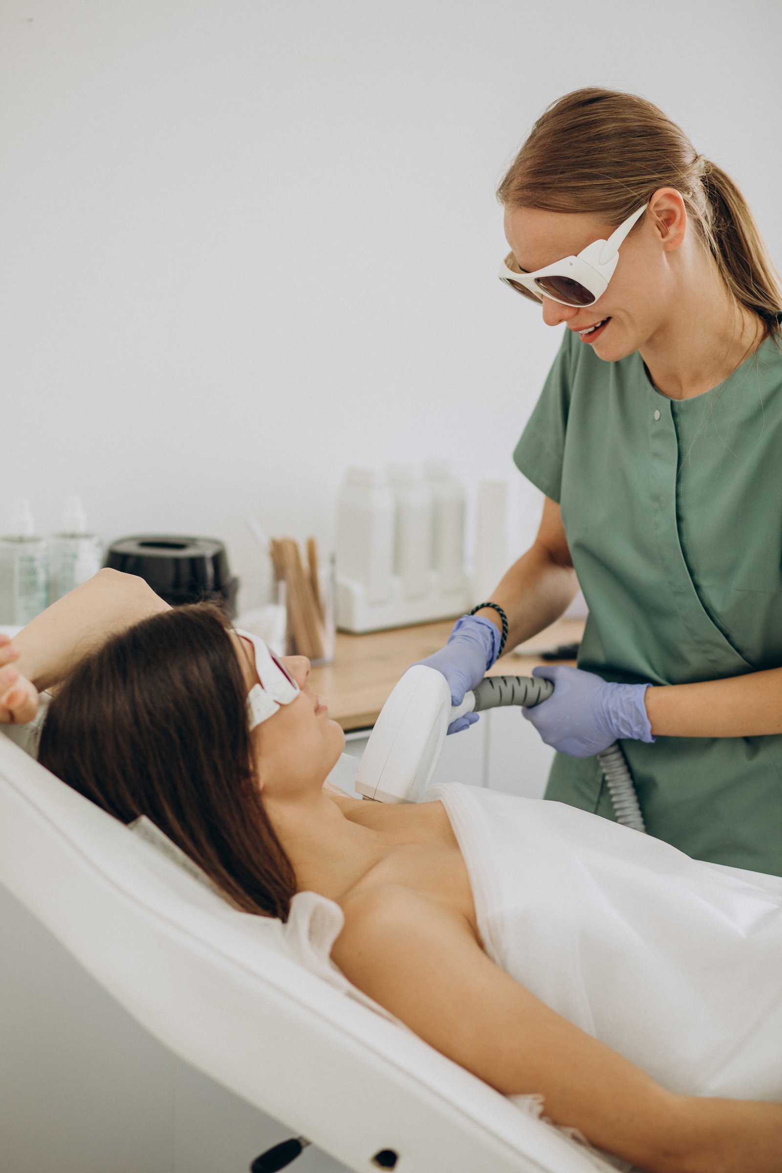 Specialist performing advanced laser hair reduction procedure at Hues Aesthetic Clinic Madurai