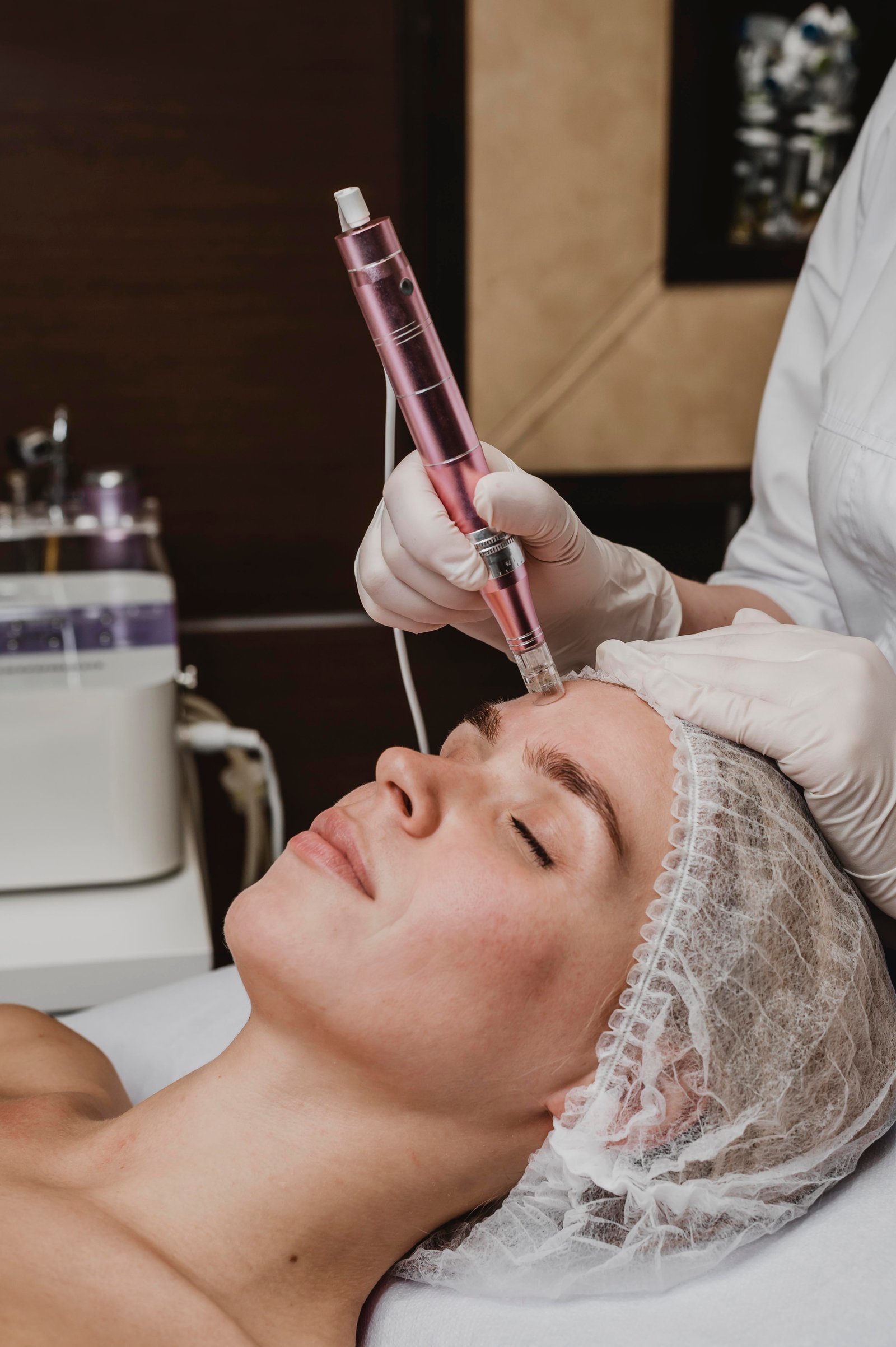 Specialist performing advanced fractional laser scar reduction at Hues Aesthetic Clinic Madurai