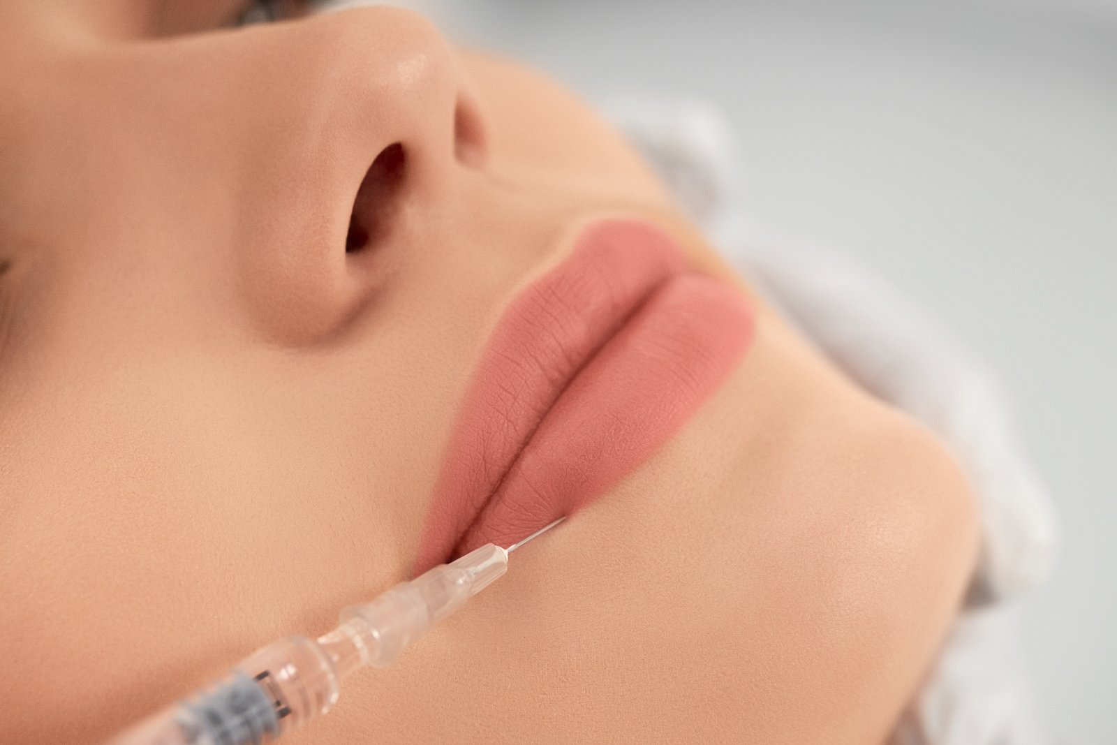 Specialist performing laser lip pigmentation treatment at Hues Aesthetic Clinic Madurai